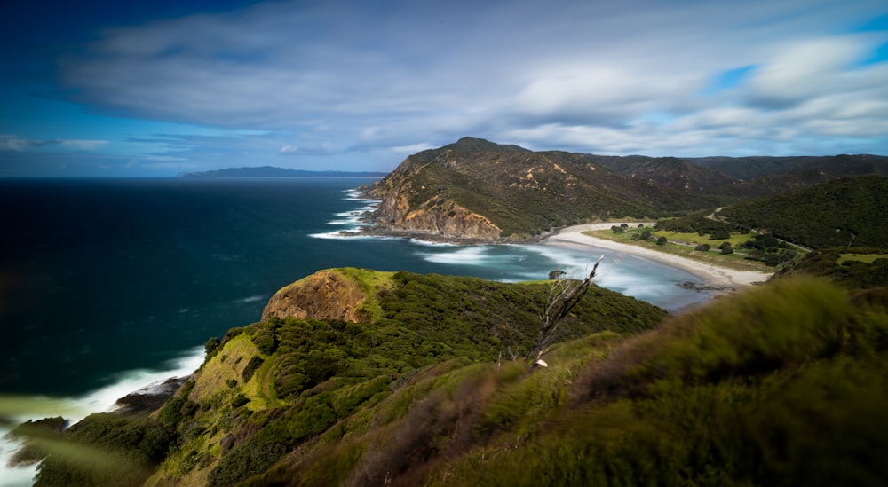 a beach with a body of water by it