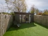 a small shed in a backyard