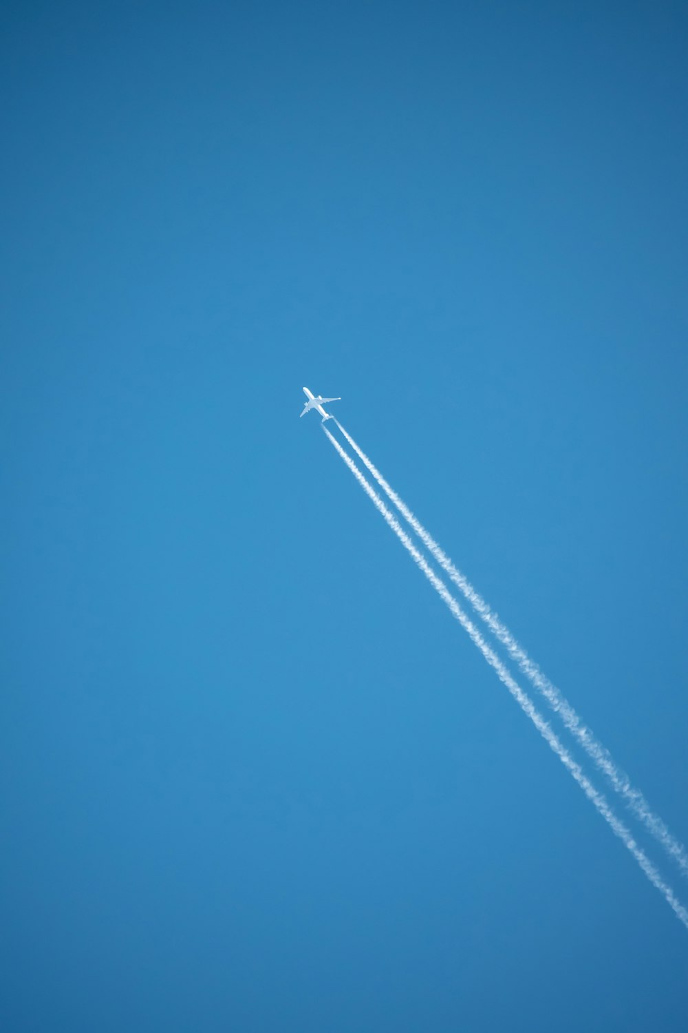 a jet leaving a trail of smoke