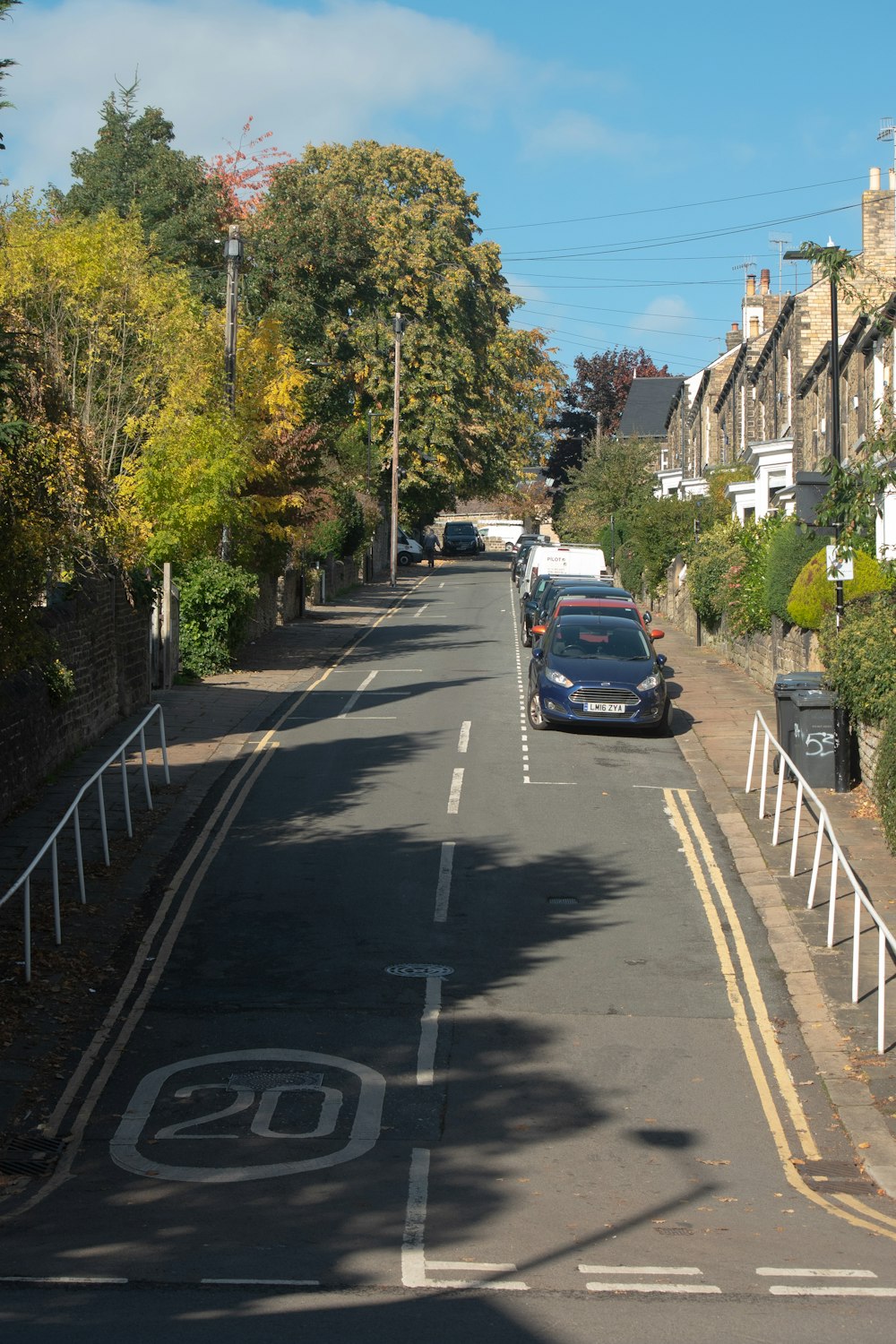 a street with cars parked along it