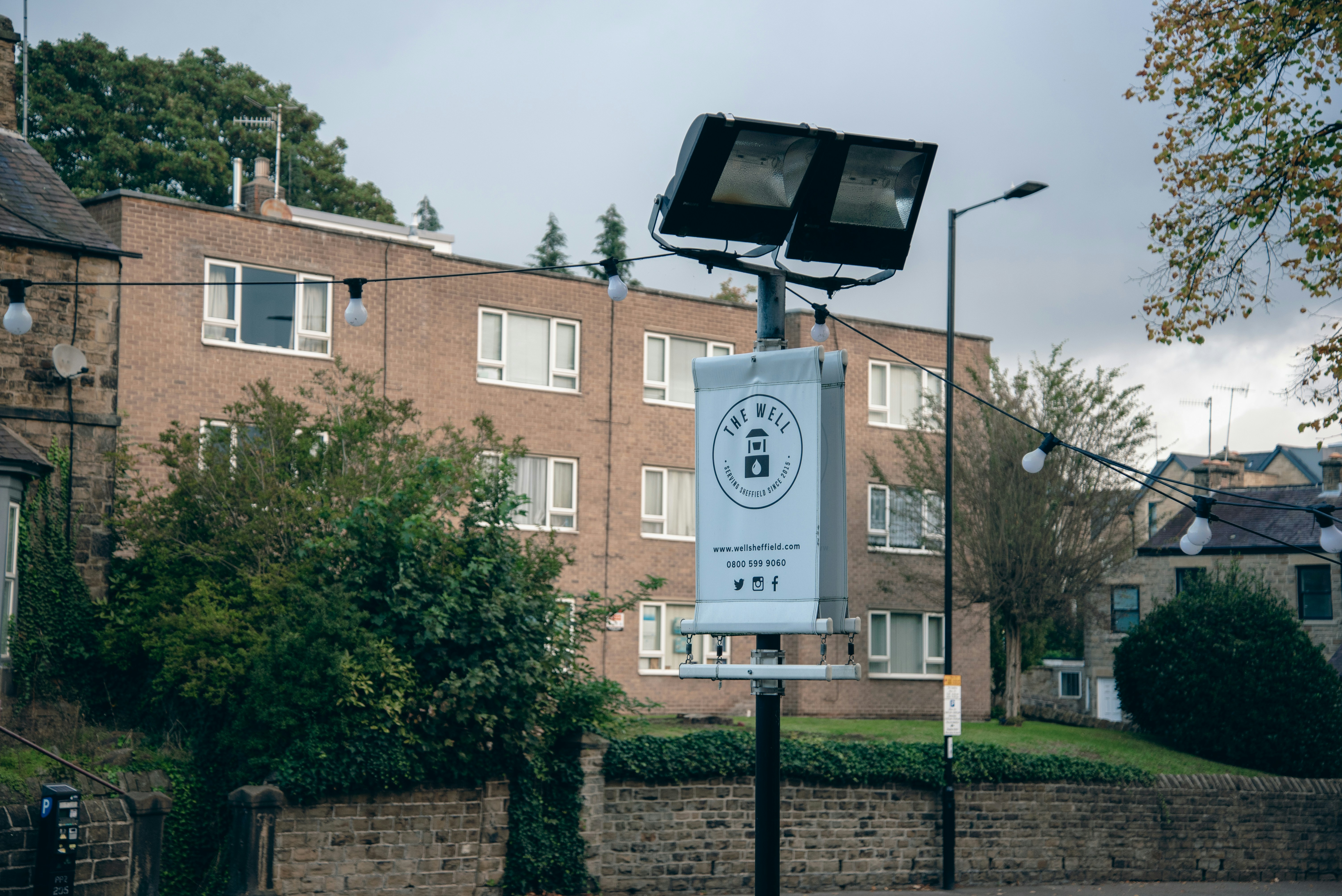 a basketball hoop in front of a brick building