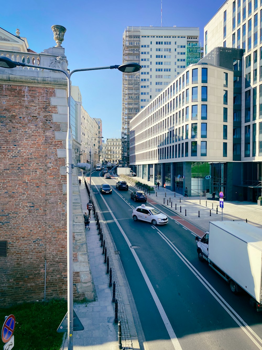 a street with cars and buildings on either side of it