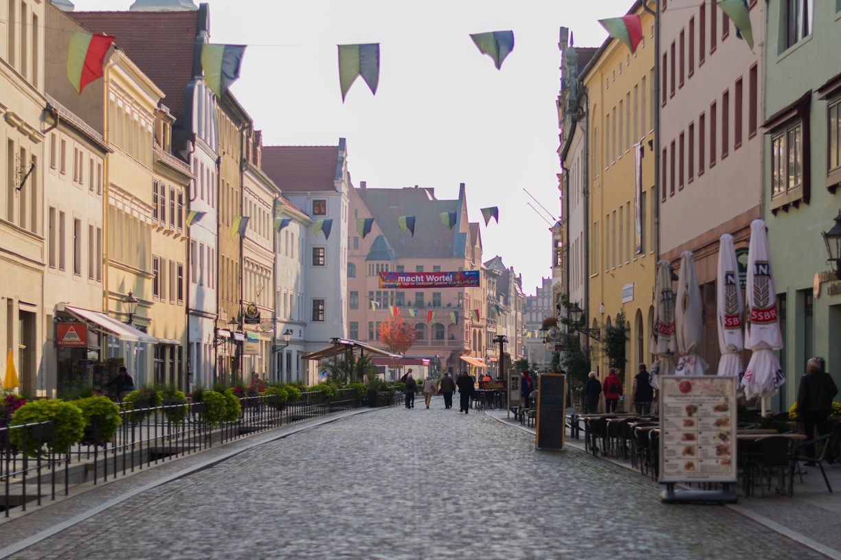 a cobblestone street with buildings on either side of it
