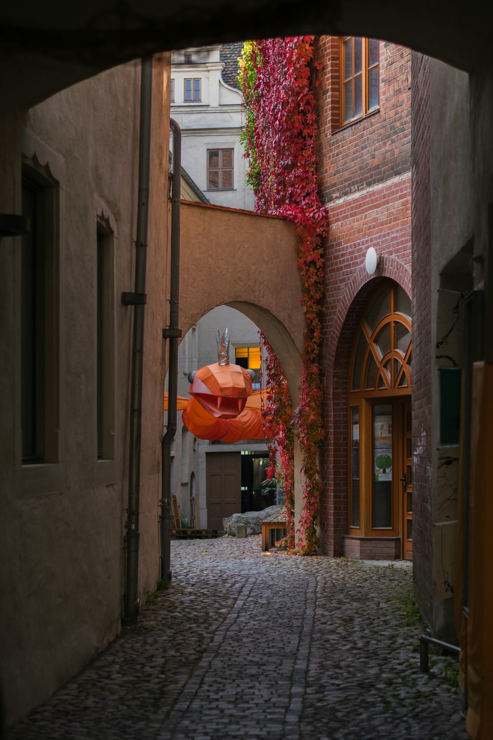 a brick building with a large archway