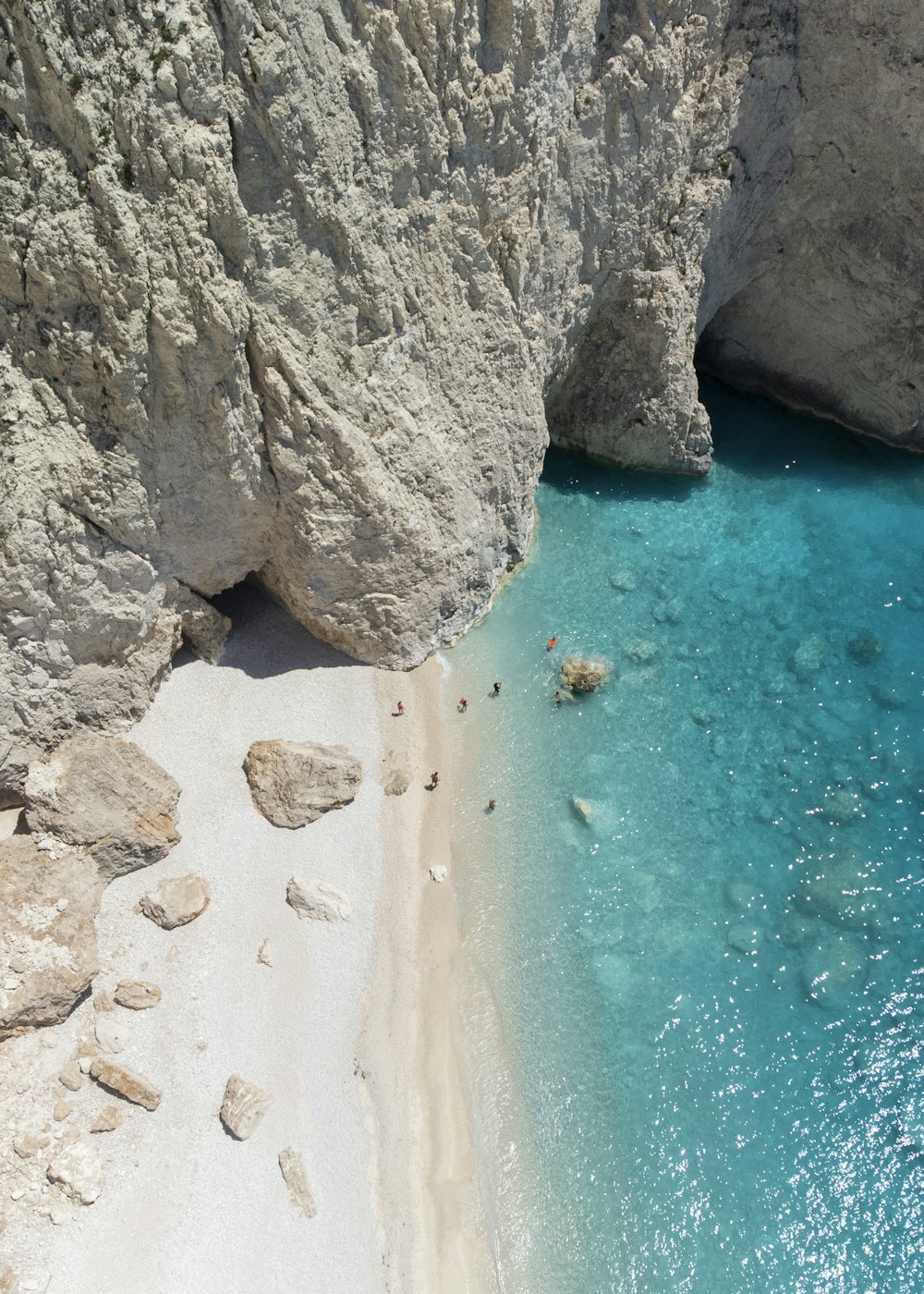 a pool of water between large rocks