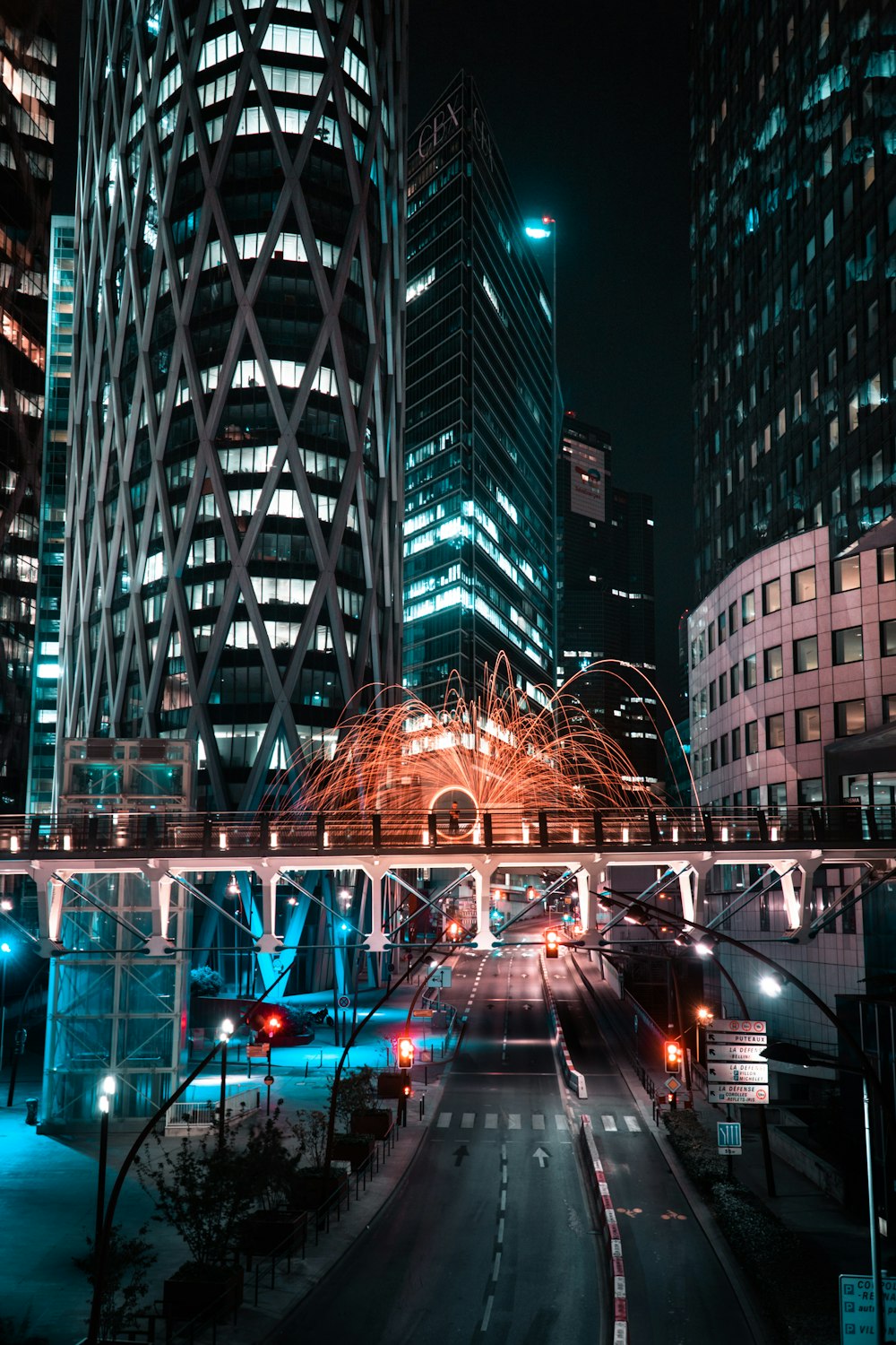 a bridge over a street in a city at night