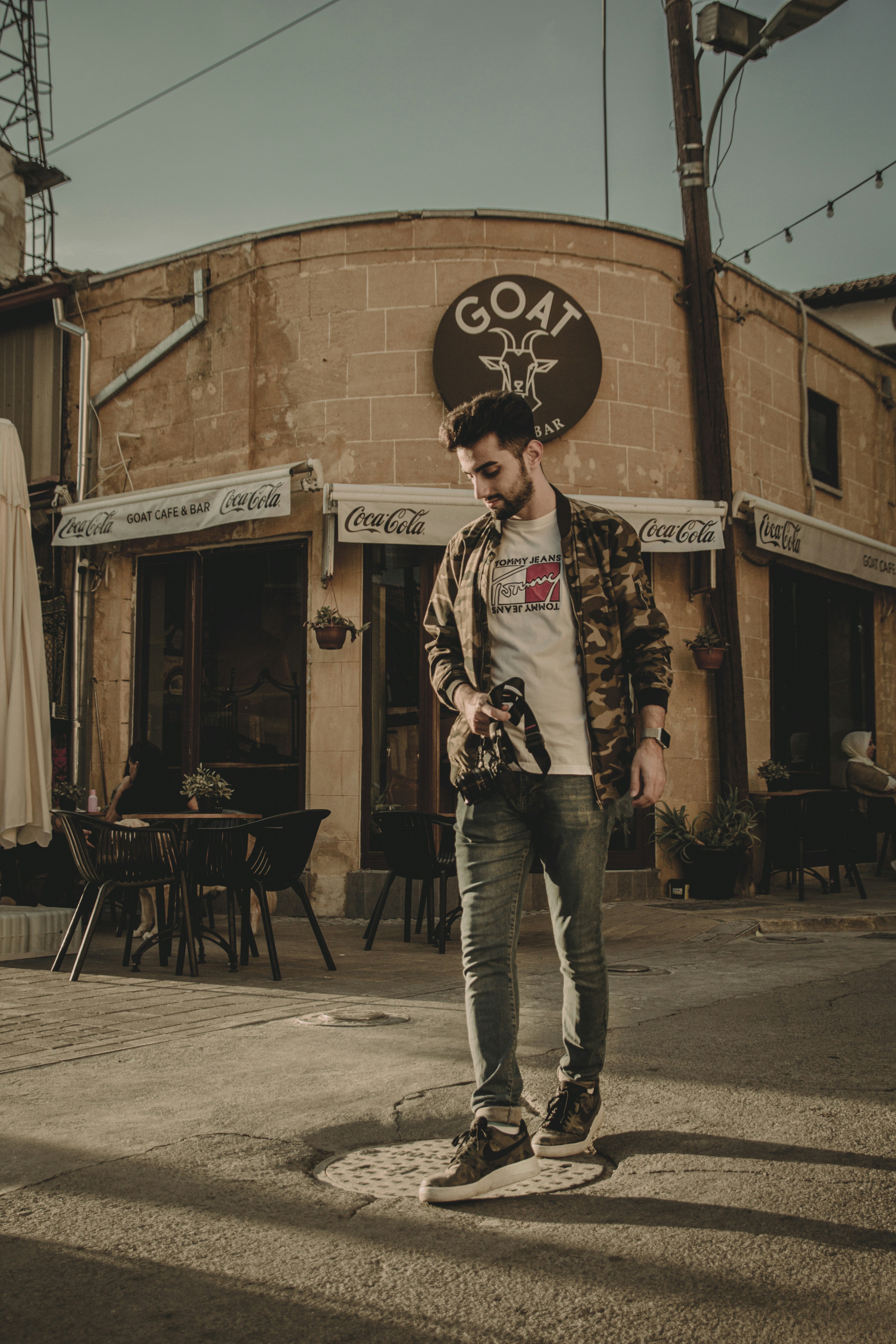 a man standing in front of a building