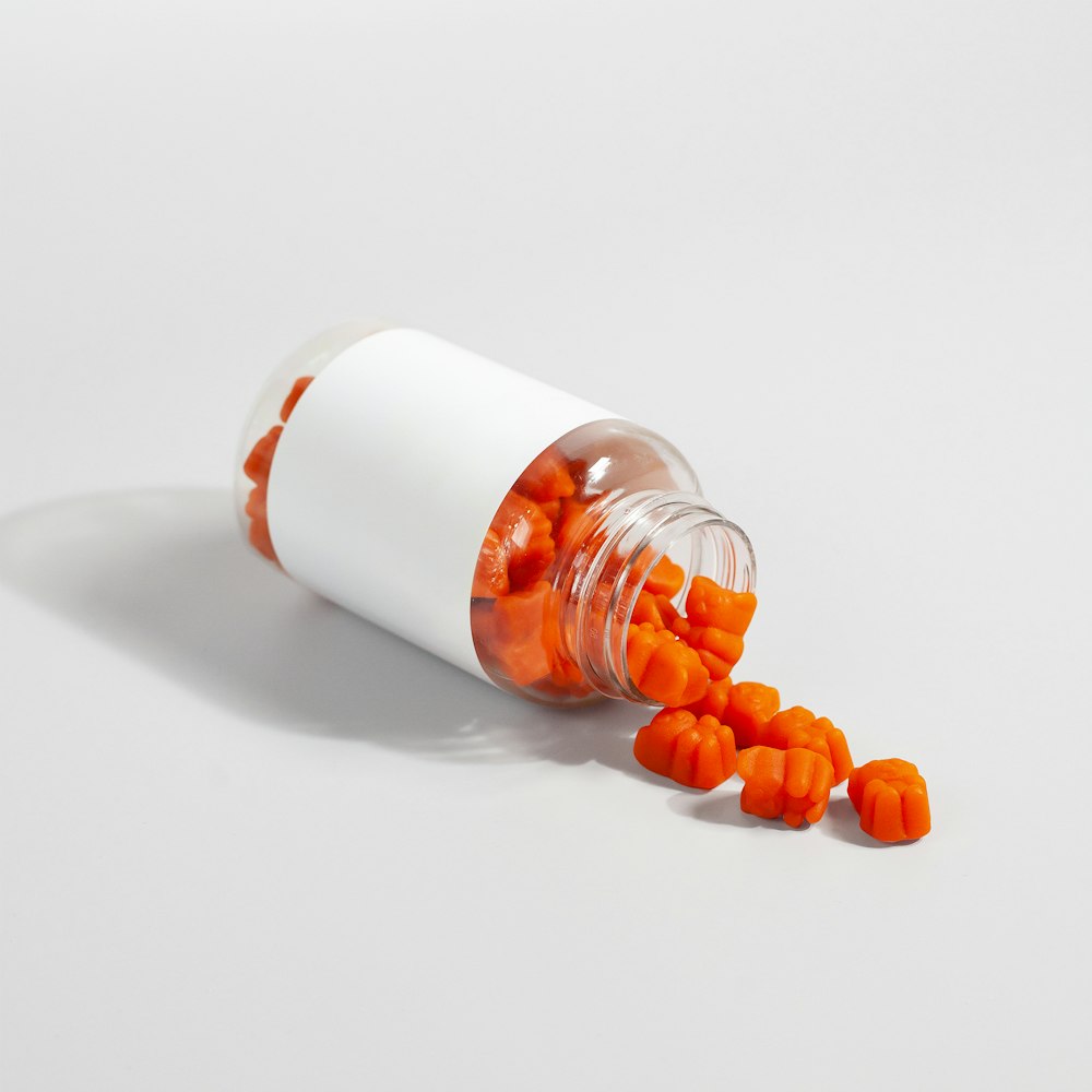 a white and orange capsule