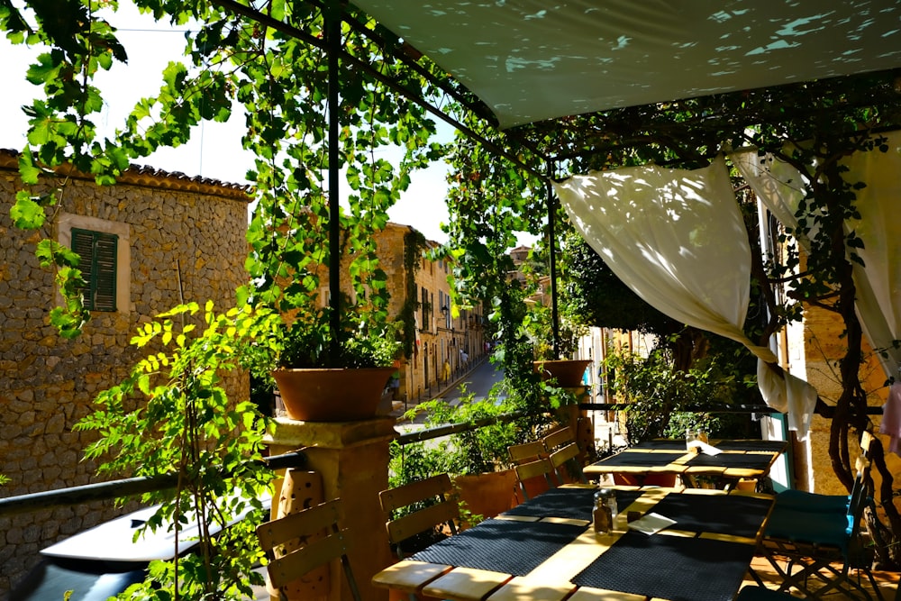 a patio with tables and chairs