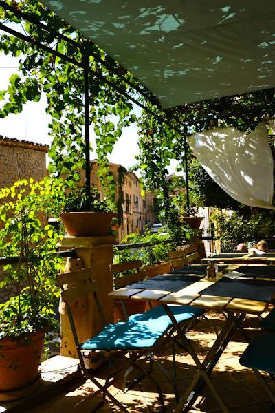 An open-air restaurant terrace set for evening dining