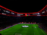 A dynamic still of the Twelfth Man Show hosts passionately discussing a recent football match with studio lights glowing.