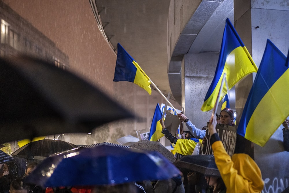 a group of people holding flags