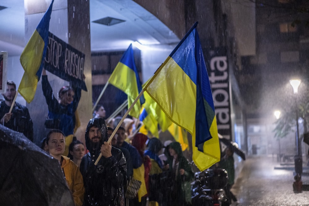 a group of people holding flags