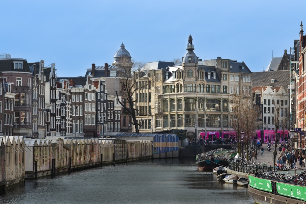 a river with buildings along it with Ghent in the background