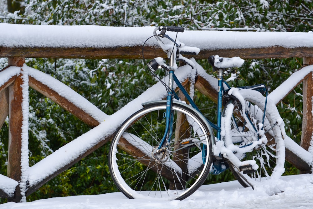 a bicycle parked in the snow