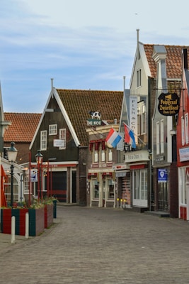 a brick road with buildings on either side of it
