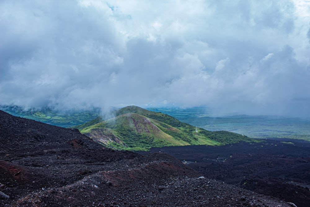 a landscape with hills and clouds