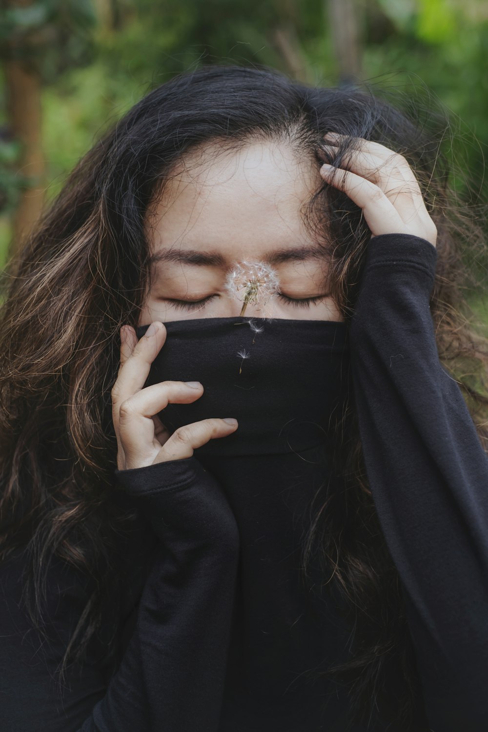 a woman with her eyes closed