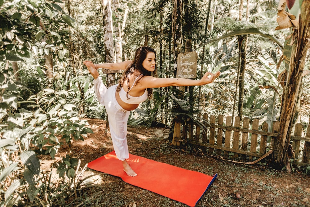 a woman doing a yoga pose