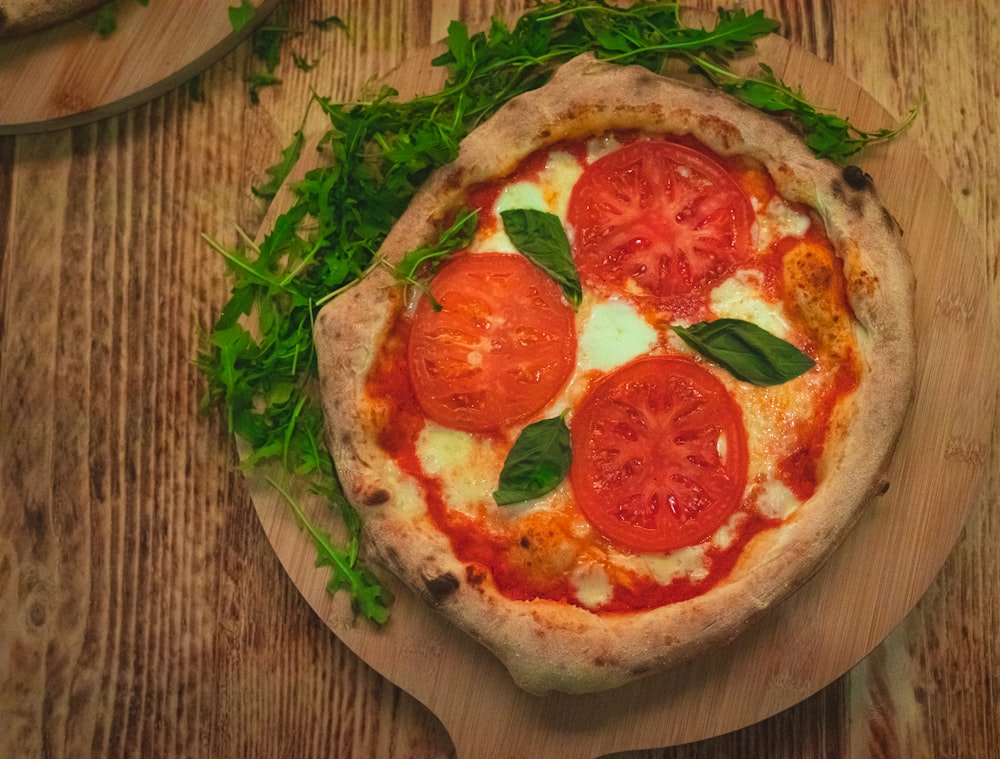 a pizza with tomatoes and basil