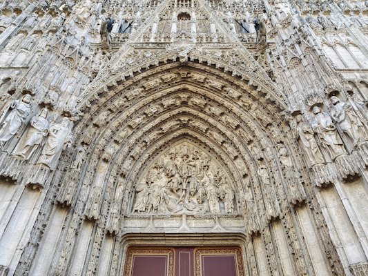 Statues on the roofline of a church — Rouen, France