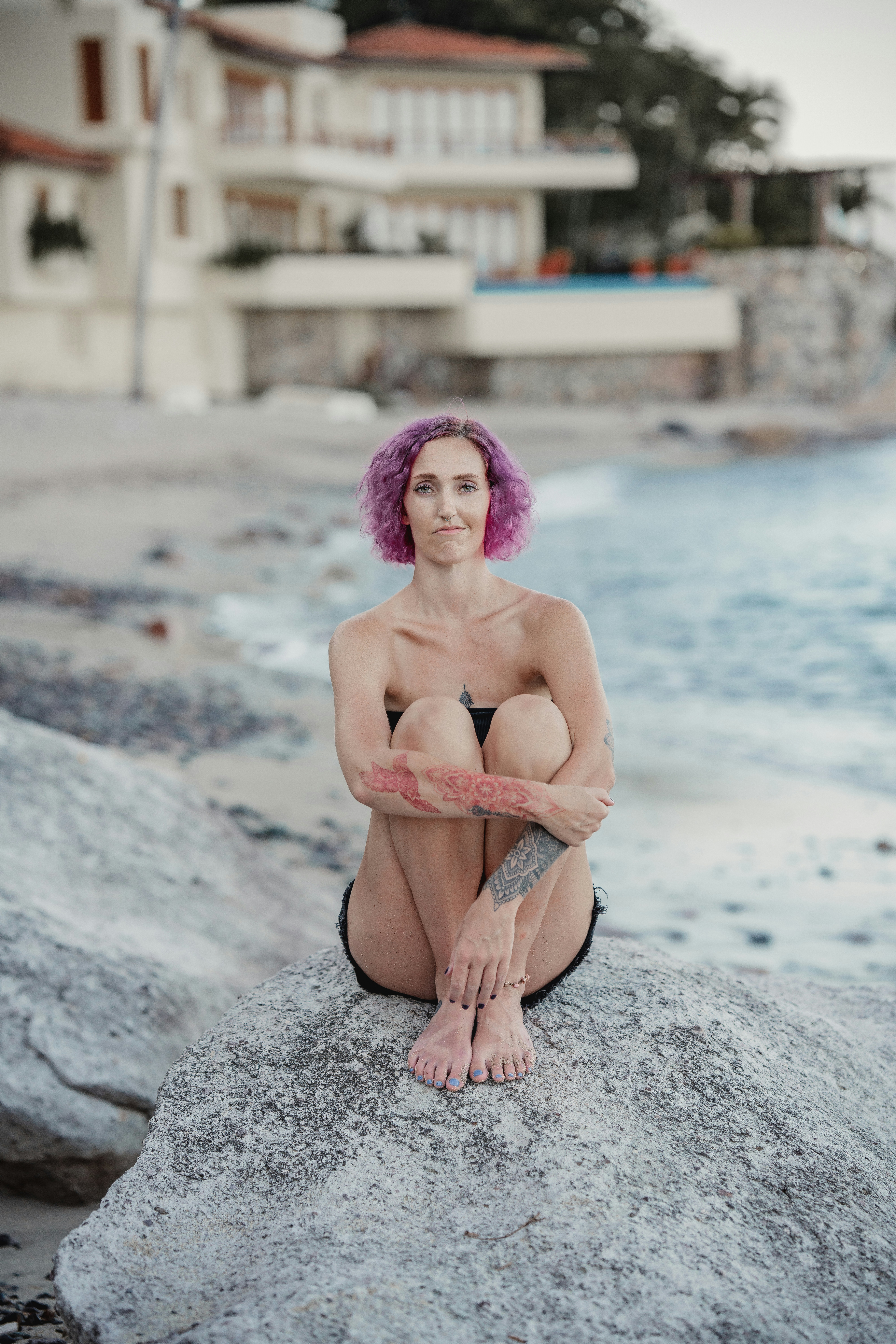 a person sitting on a rock