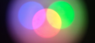 An abstract illustration showing interconnected circles representing education, well-being, and digital ethics in calming blue and gray hues.