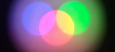 Minimalist blue and amber overlapping circles representing partnership.