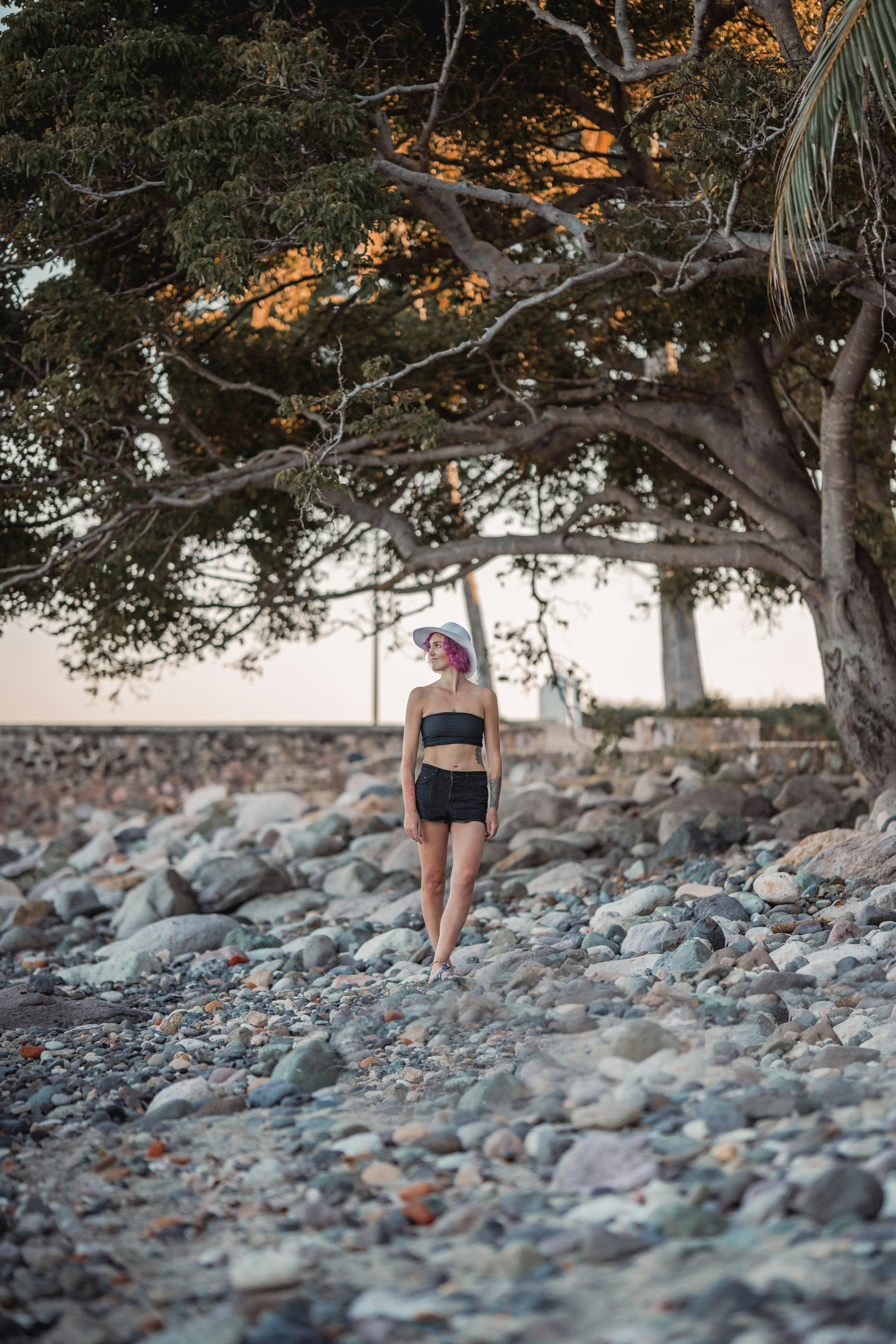 a person standing under a tree