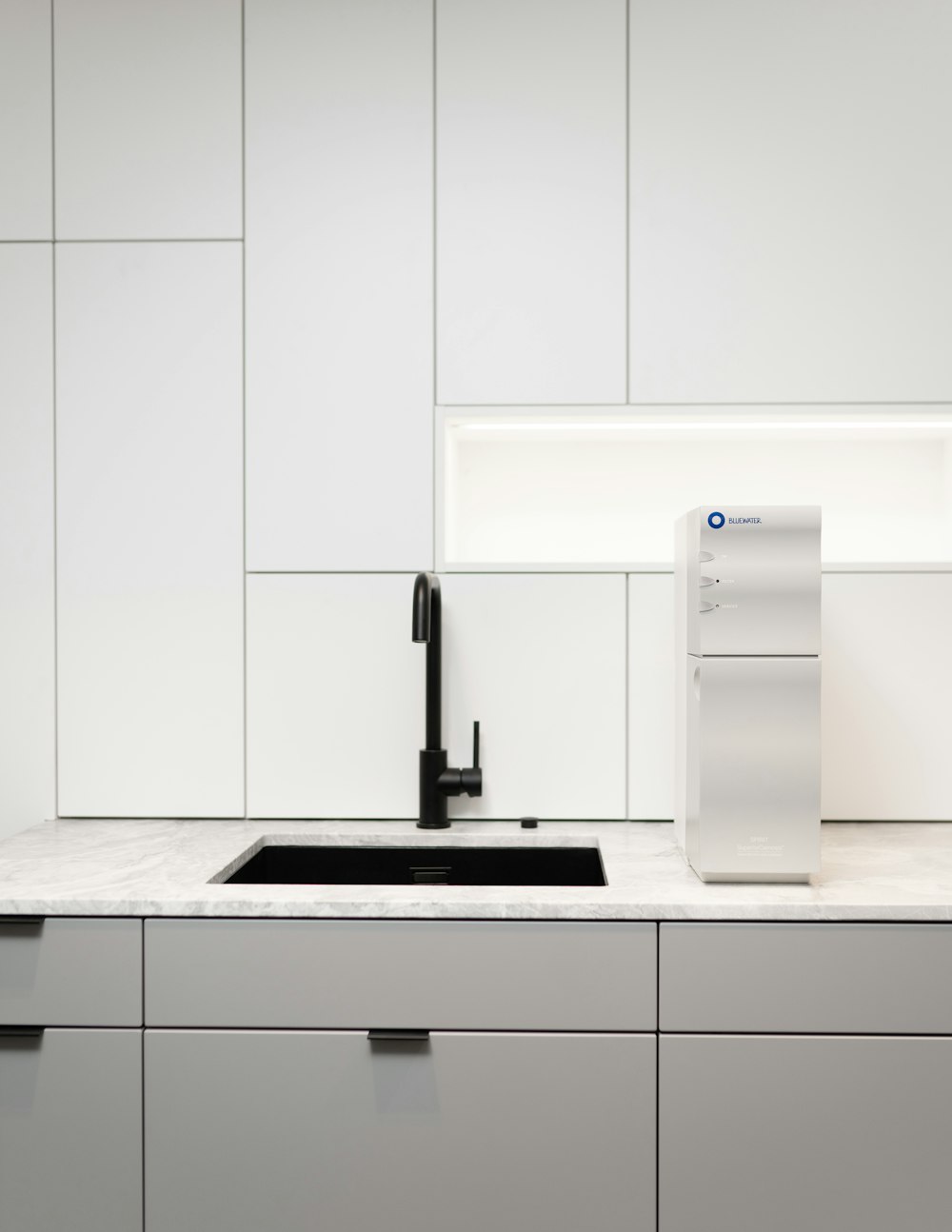 a kitchen with white cabinets