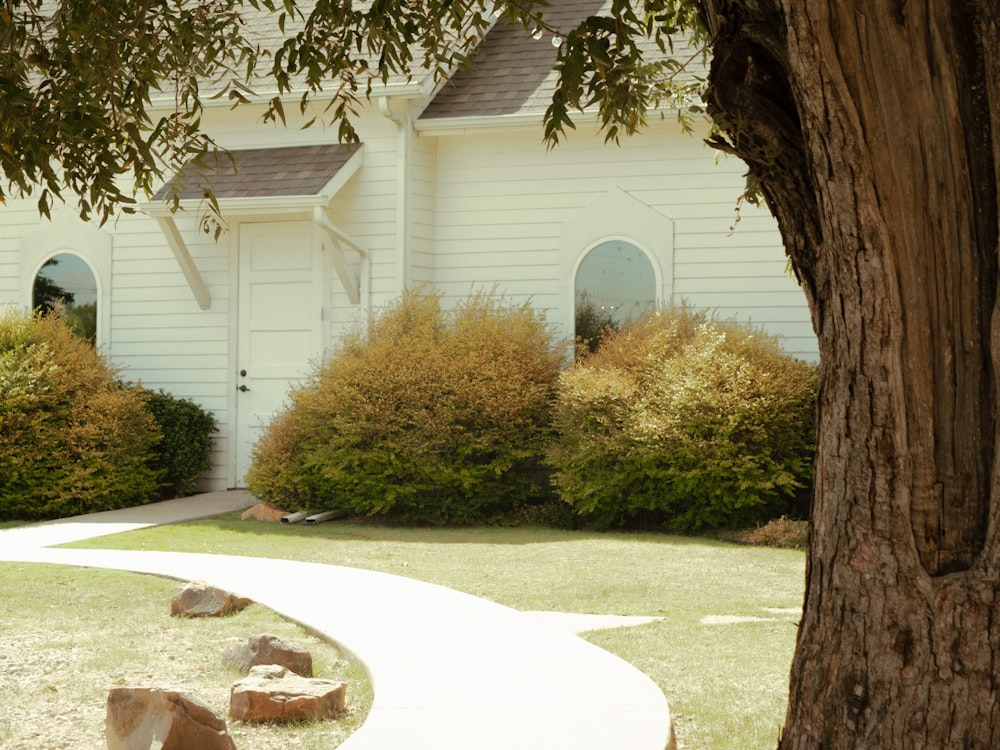 a white house with a driveway