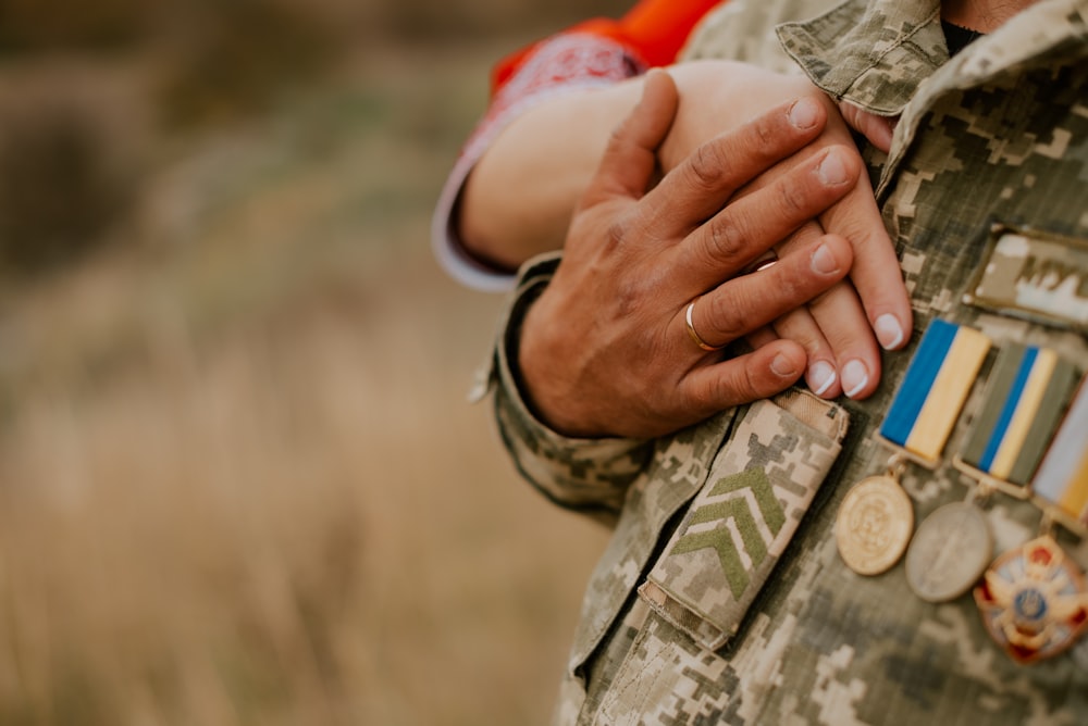 a close-up of hands holding coins