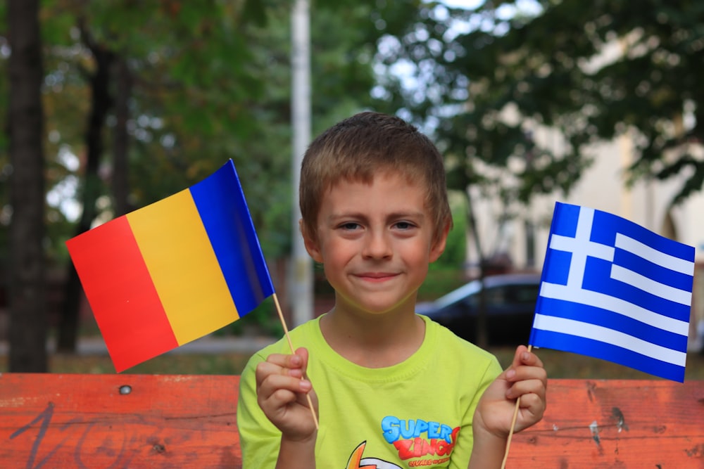 a boy holding a flag