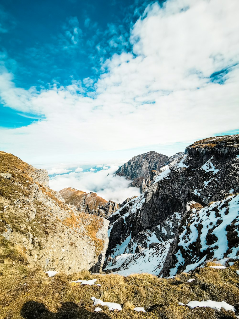 a rocky mountain with snow