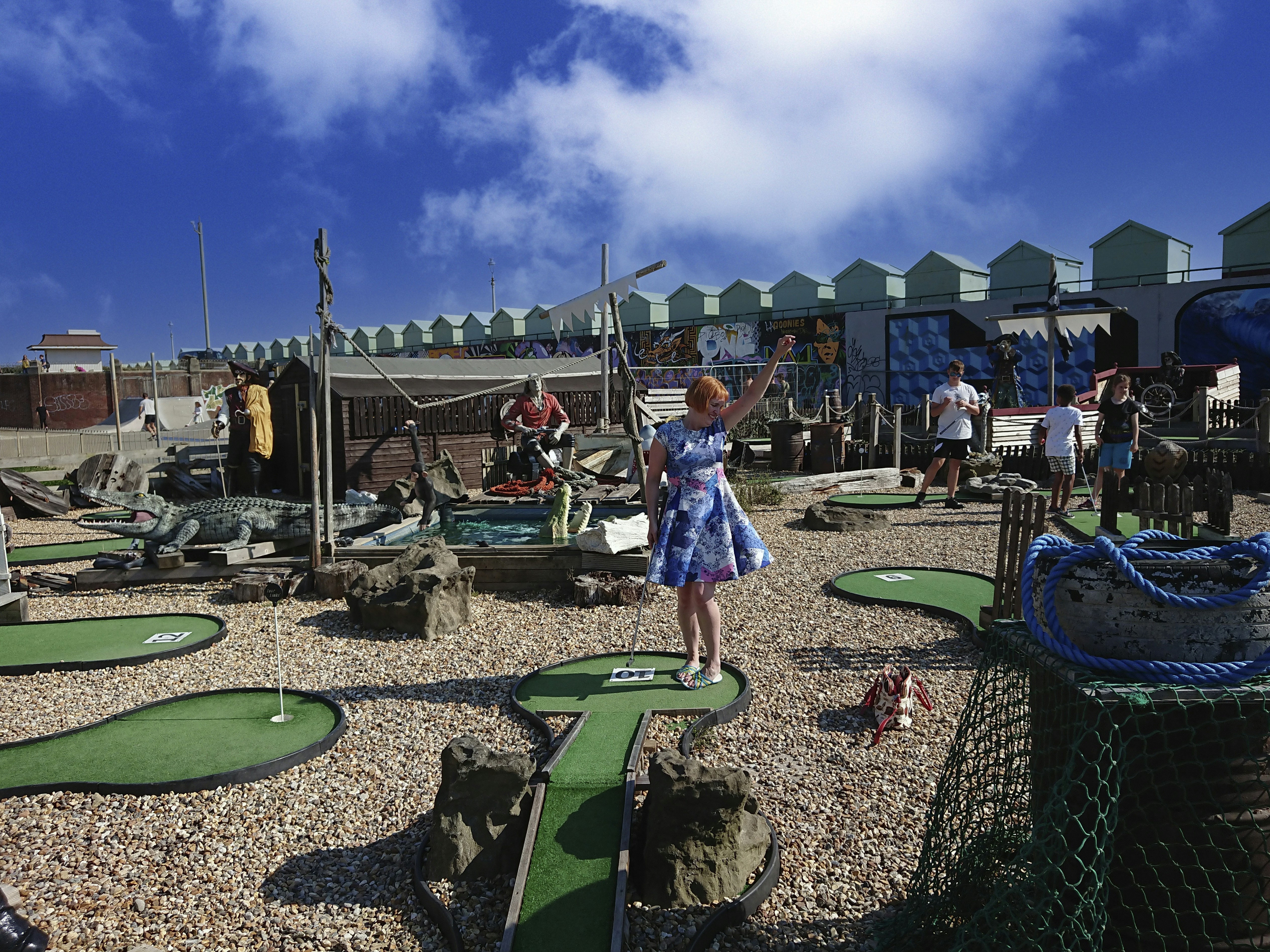 a person standing next to a playground