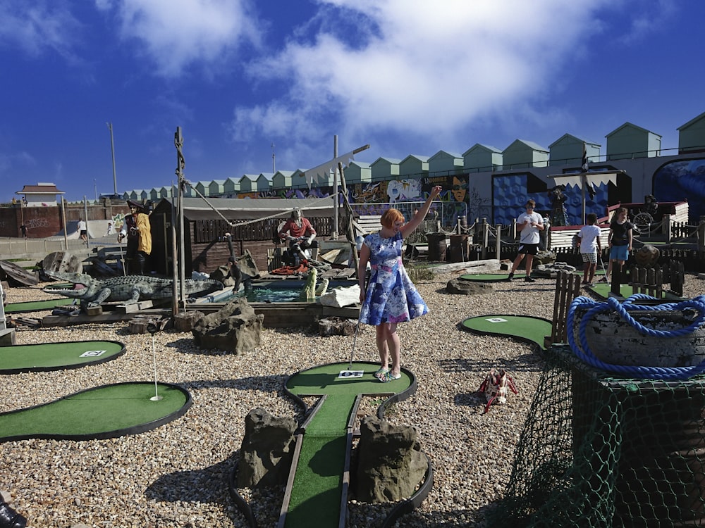 a person standing next to a playground