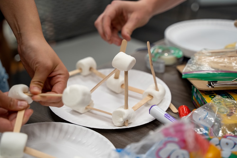 a person painting a cake