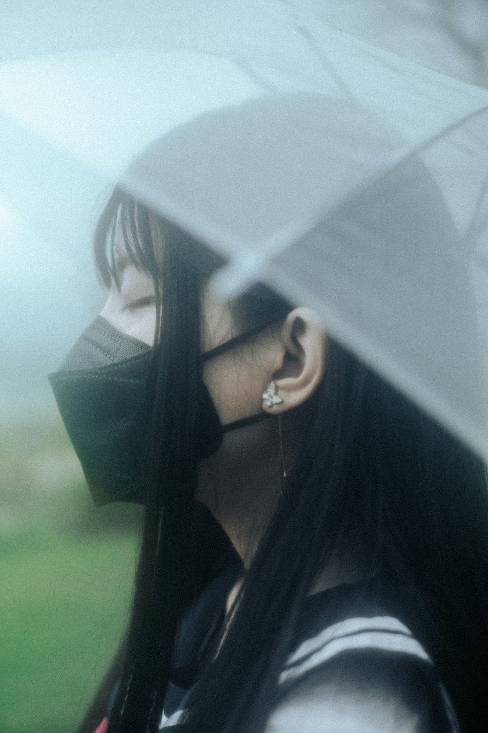 a woman with a black umbrella