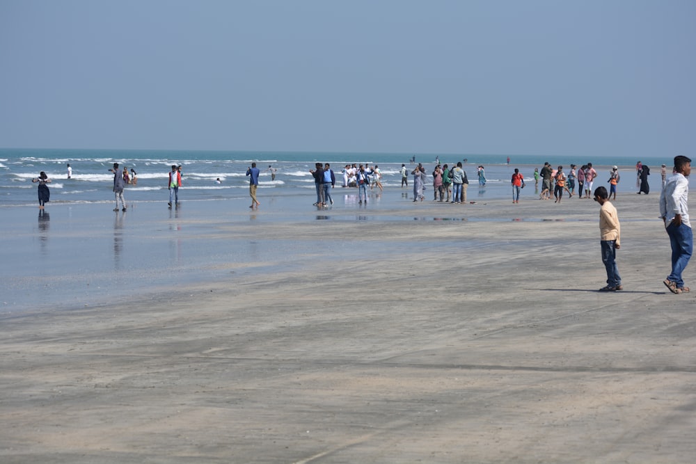 a group of people on a beach