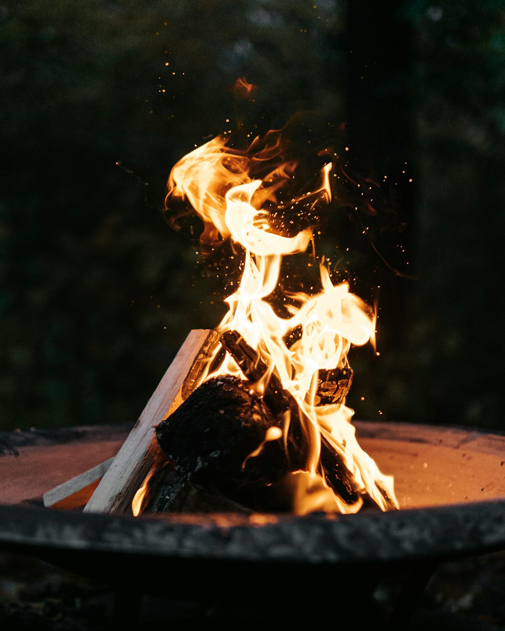 a fire burning in a pit