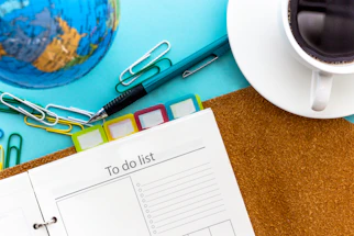 a calendar and scissors on a table