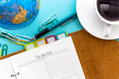 a calendar and scissors on a table