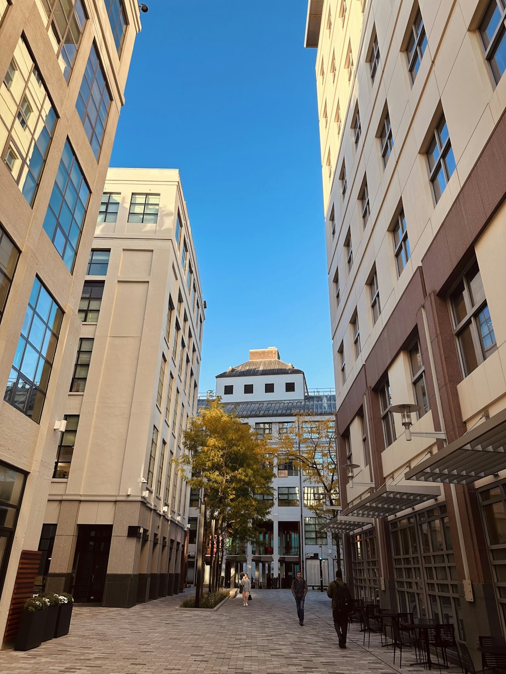 a group of buildings with people walking