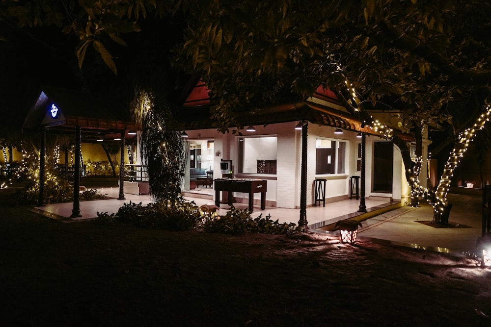 a house with lights on at night