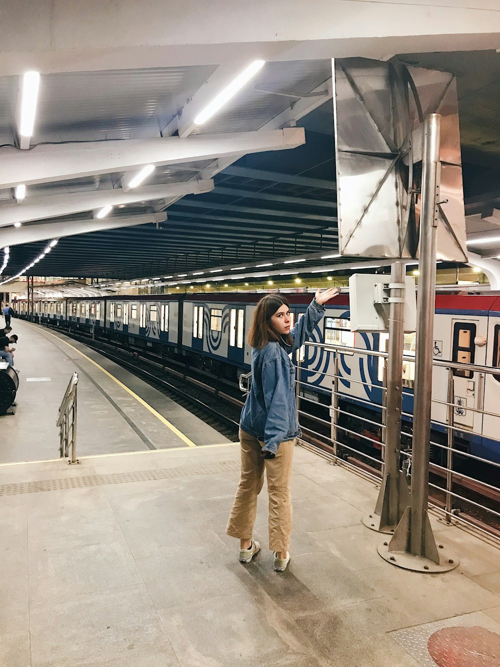 a person standing in a train station