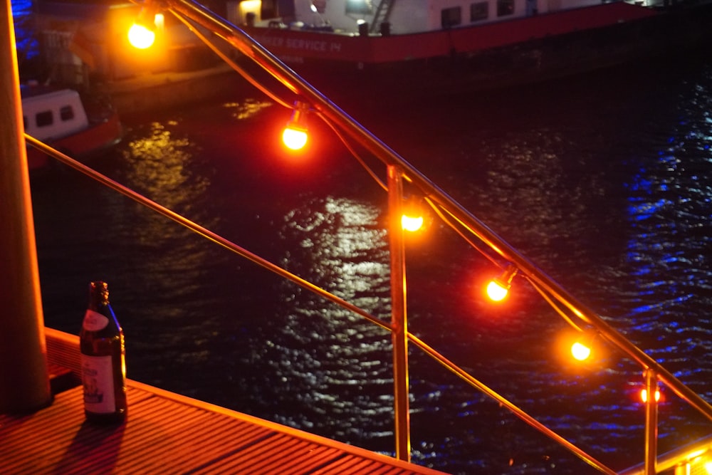 a bottle of beer on a dock