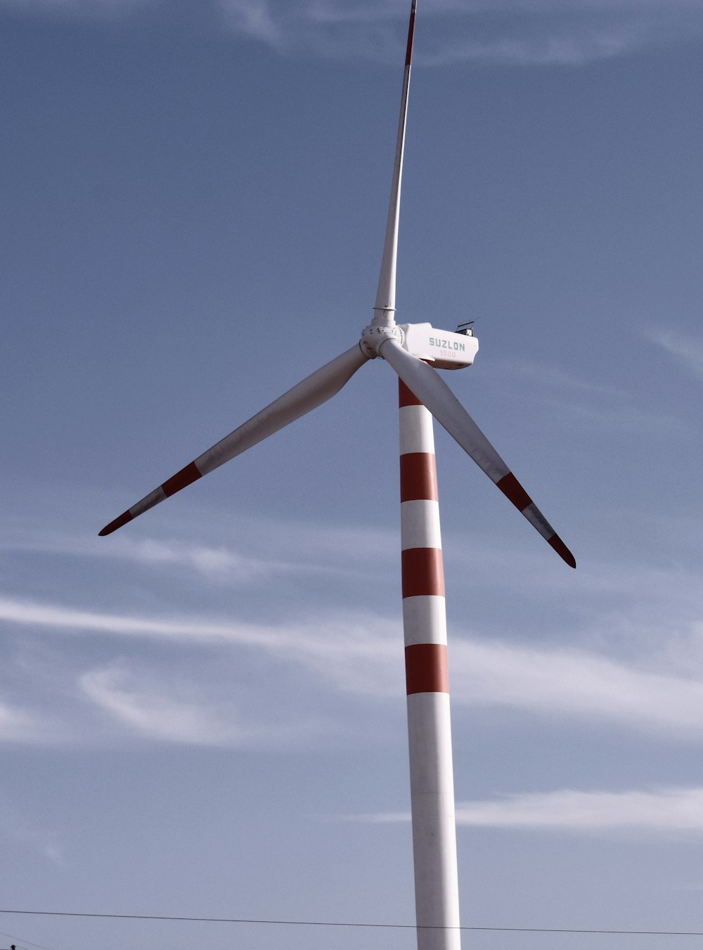 a windmill with a red and white stripe