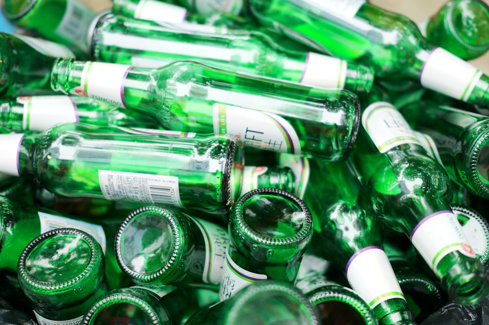 a pile of green bottles