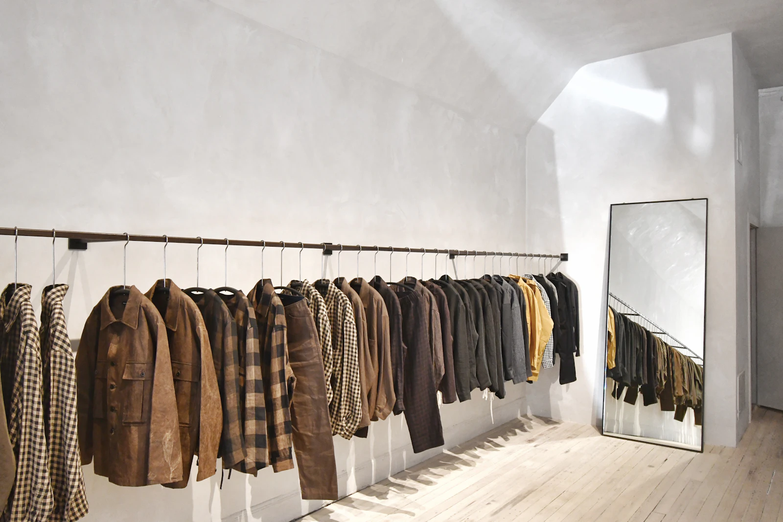 A wall of neatly displayed garments