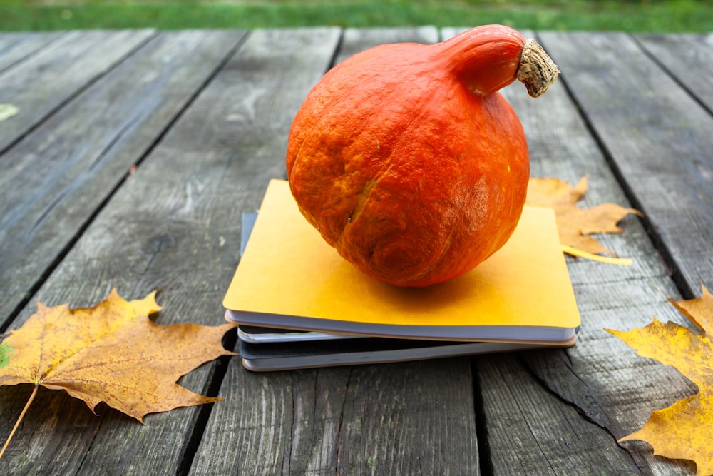 a pumpkin on a book